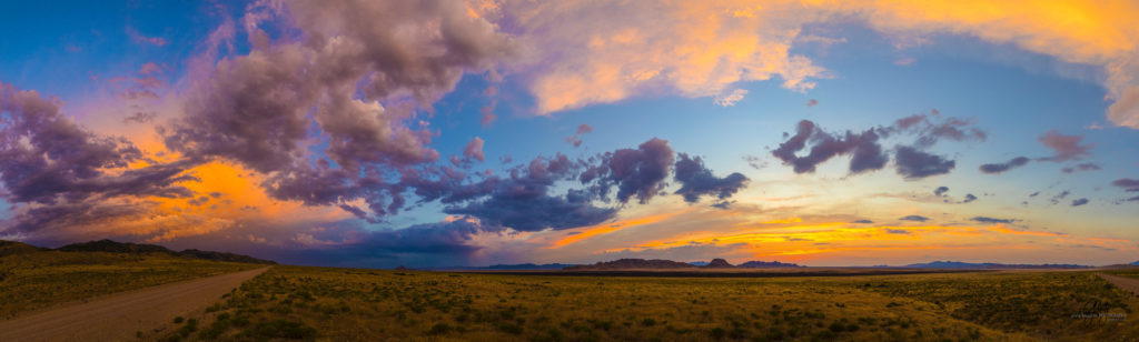 Photography of a Sunset in Utah's West desert.  Wild horses in the distance